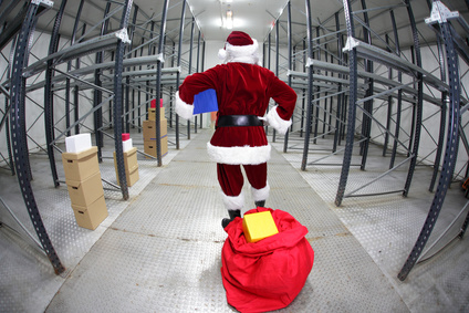 Late Santa Claus in empty storehouse